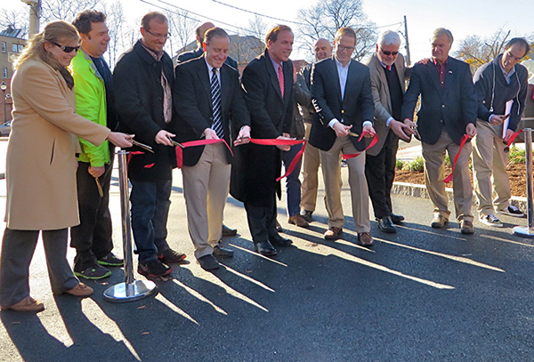 Photo of Kimberley Sloan, Project Manager, MassDOT; Peter Sutton, MassDOT; Phil Goff, East Arlington Livable Streets Coalition; Paul Stedman, Director, MassDOT Highway Division District 4; State Representative David M. Rogers; Adam Chapdelaine, Town Manager, Arlington; Kevin Greeley, Chair, Arlington Board of Selectmen; State Senator Kenneth Donnelly; Nathaniel Cabral-Curtis, Howard-Stein-Hudson Associates; and (back row) Joe Curro, Arlington Selectman.