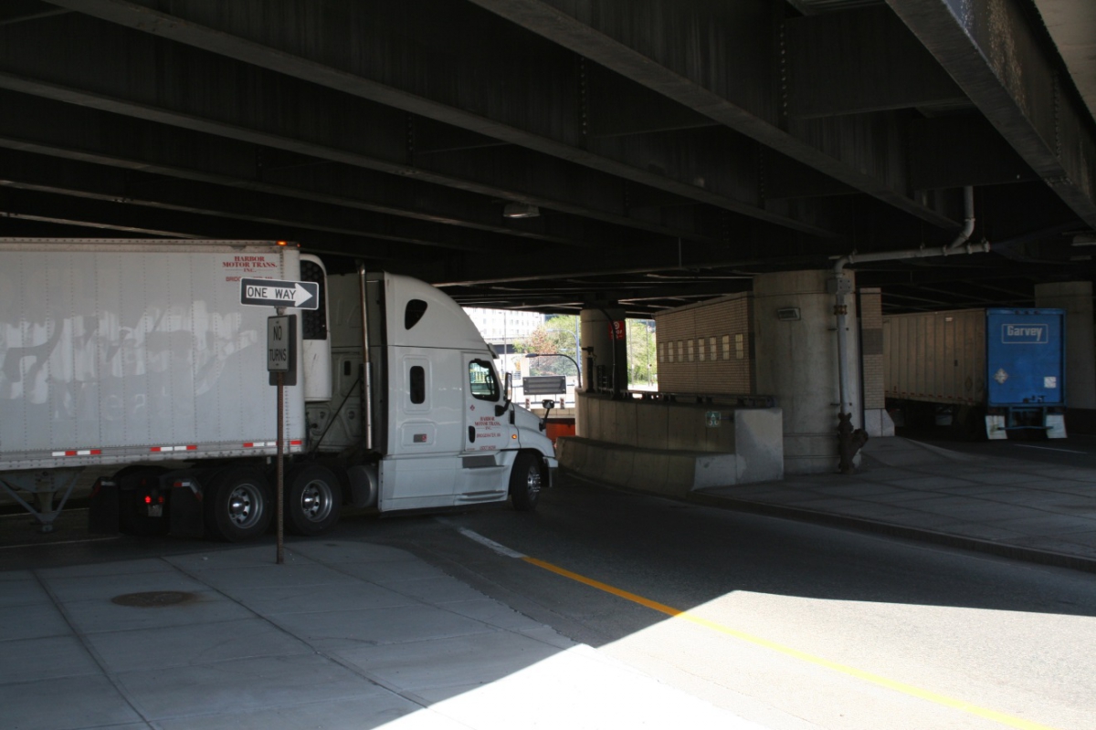 Truck tractor with sleeper cab pulling a refrigerated semi-trailer