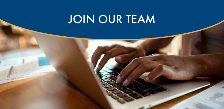 Photograph of person's hands on a laptop keyboard with text above reading "Join our team"